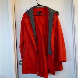 Hooded poppy colored jacket; removable hood.